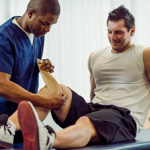 Picture of a PT helping a man with an injured knee